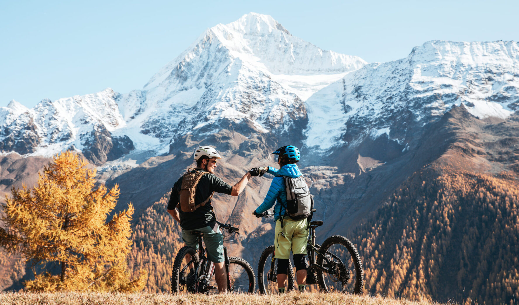 Two mountain bikers on a tour in the Alps