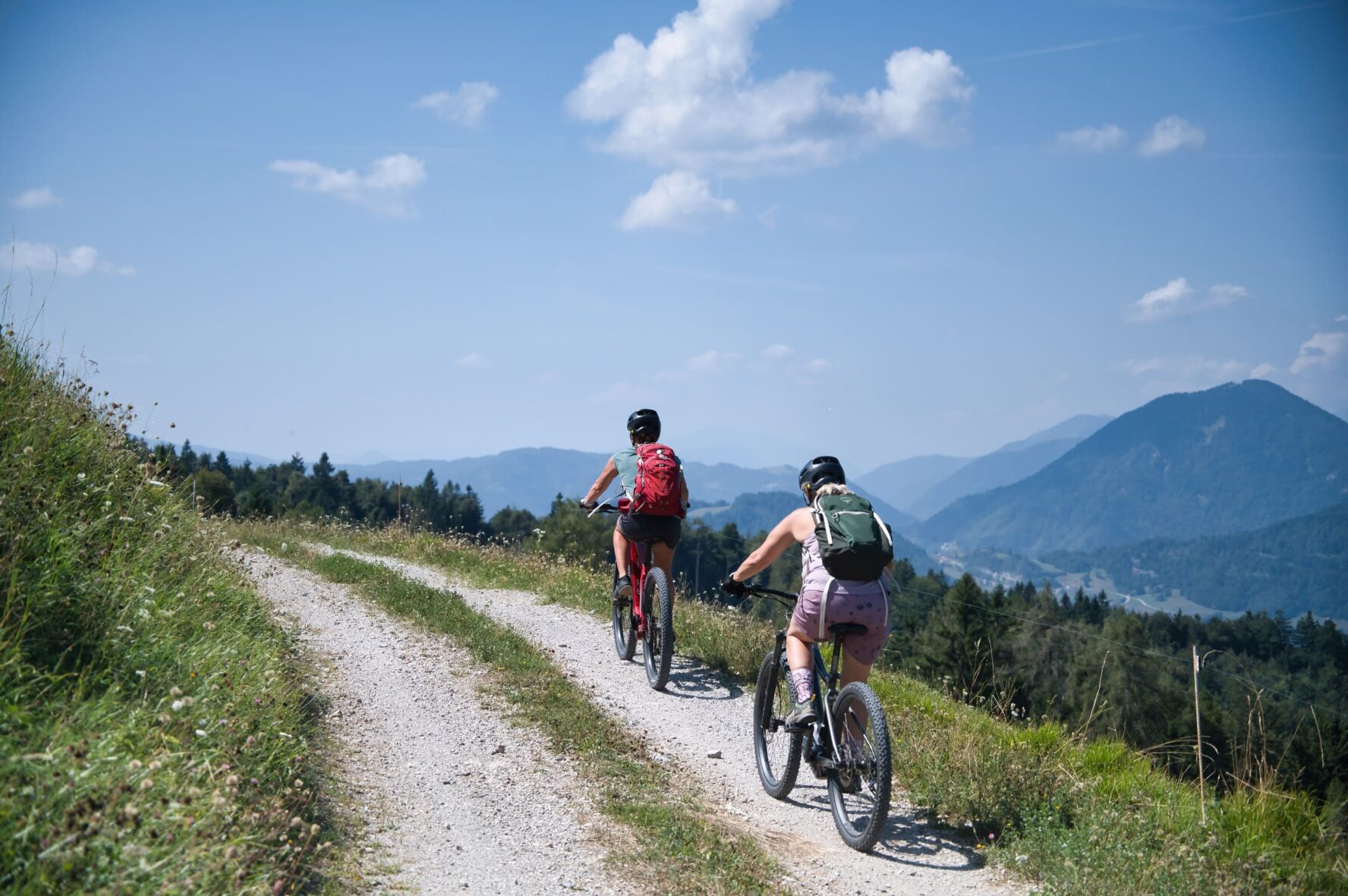Two people e-MTB Julian Alps on a high Alpine trail