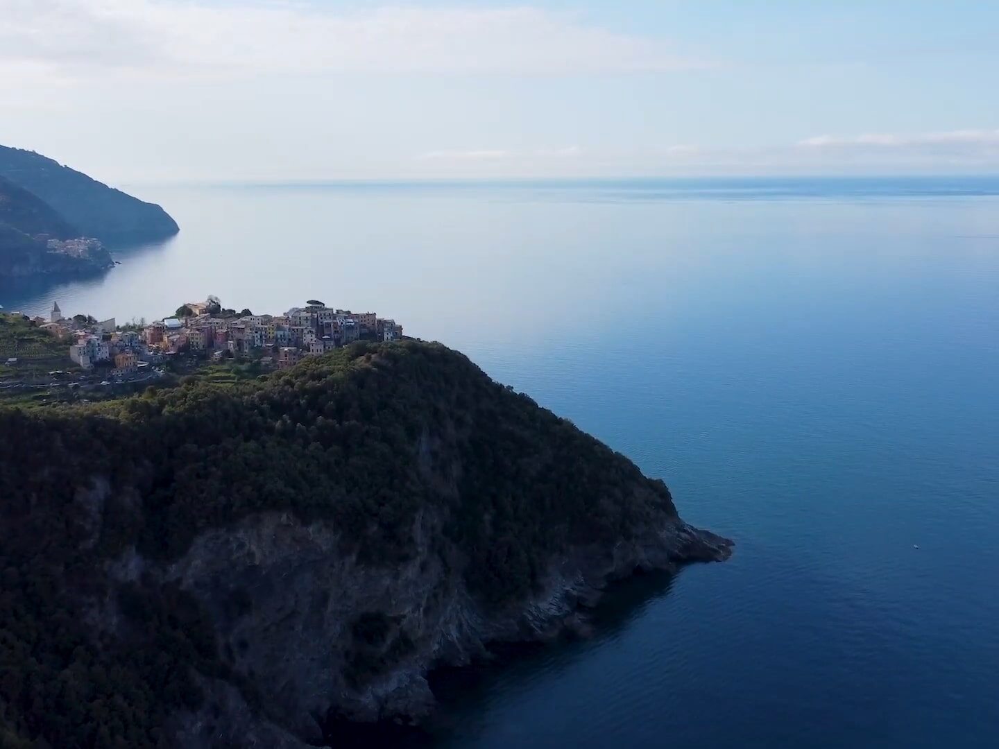 View from afar of Portovenere on a cliff overlooking the sea