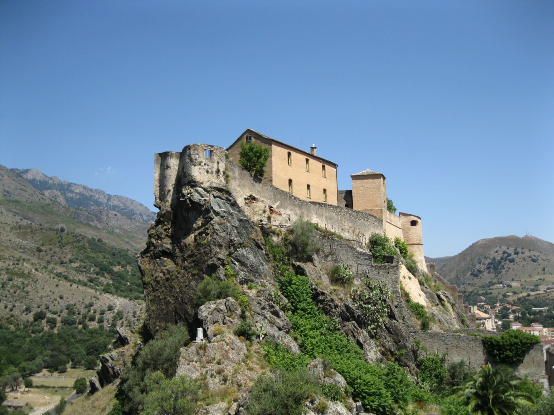 View of Corte houses on a hilltop on the Corsica walking holidays