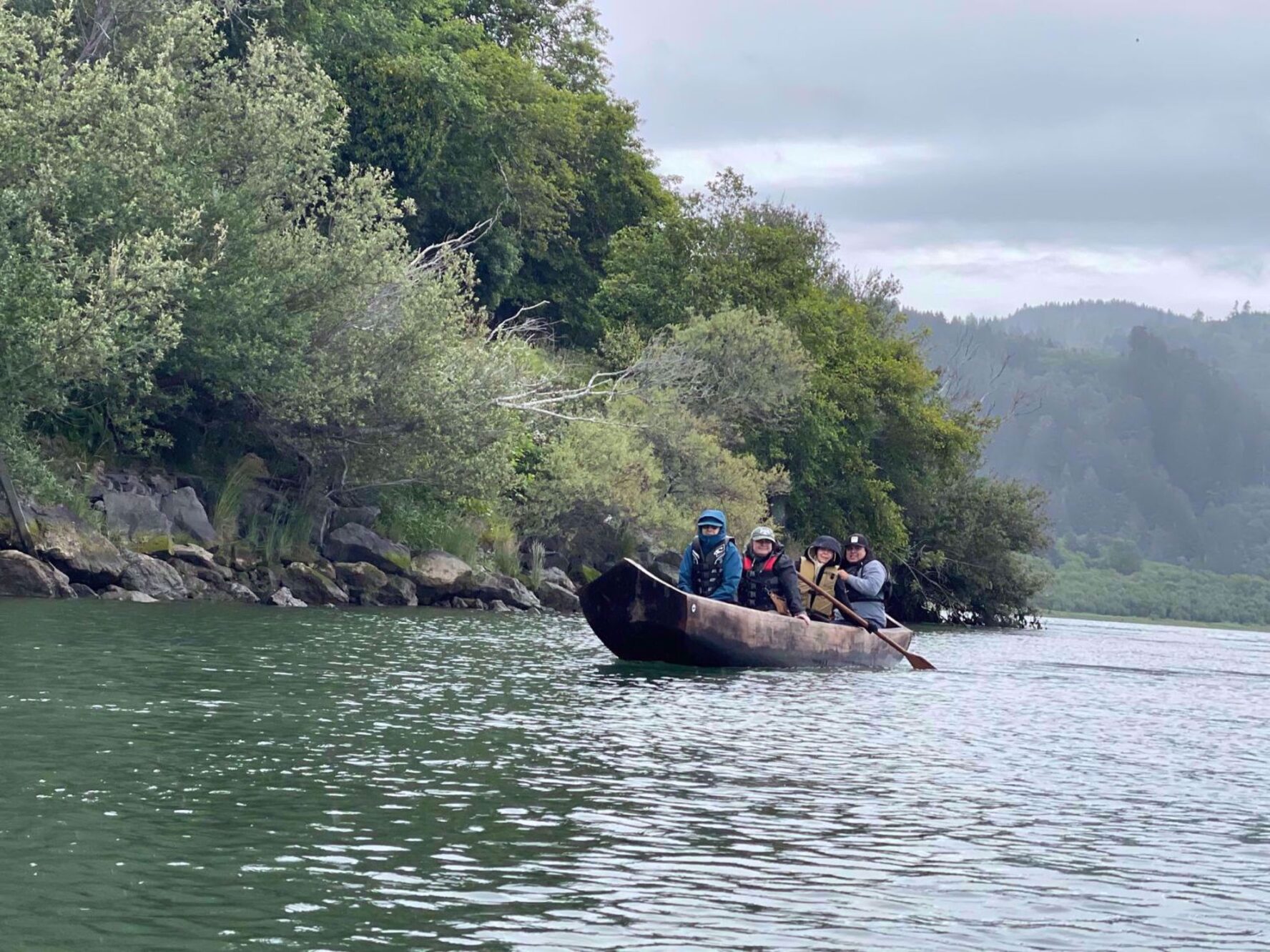 Group in a canoe on the Redwood wellness tour