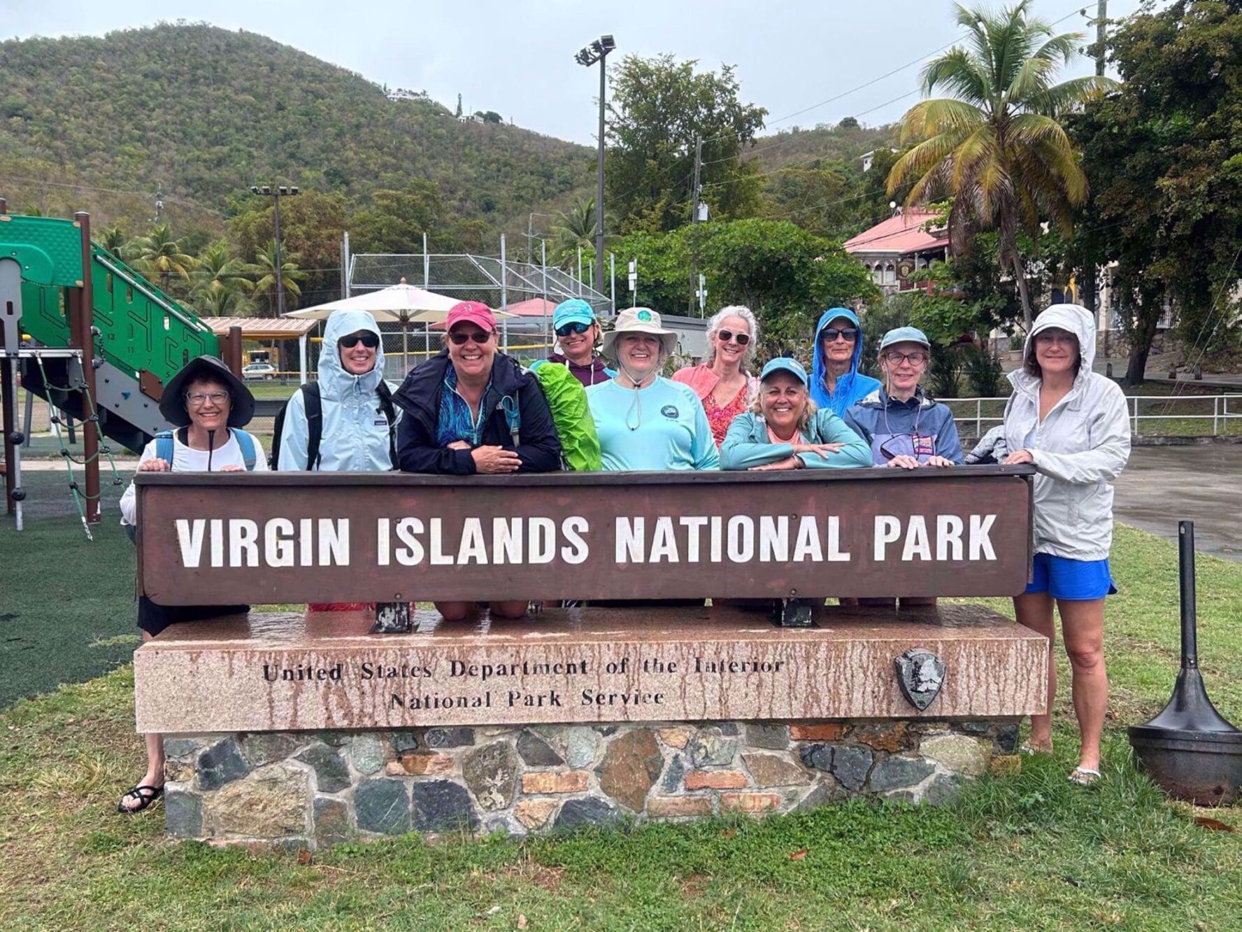 Group smiling at the entrance to Virgin Islands National Park