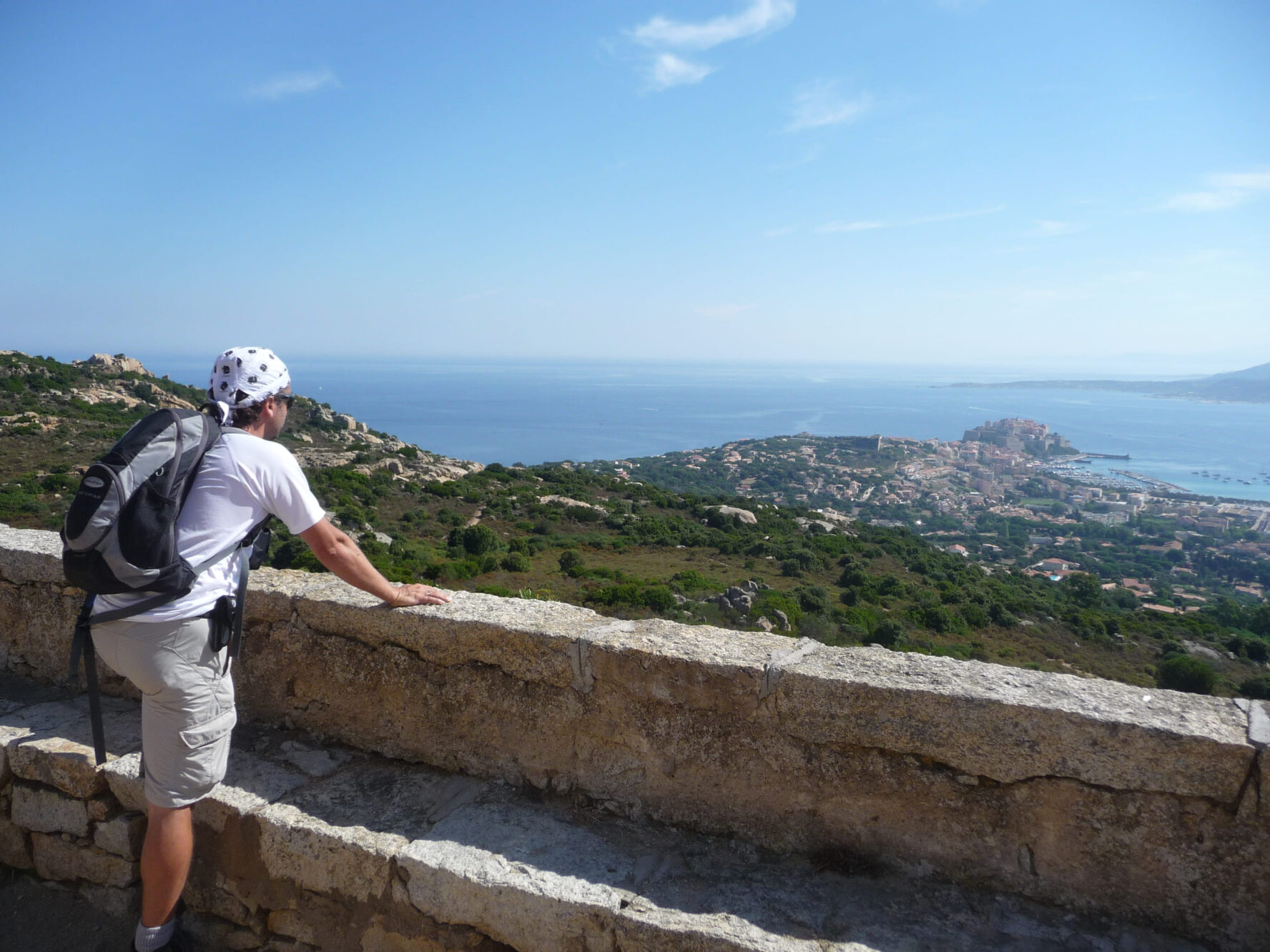 Hiker on a panorama over Calvi on the Corsica walking holidays