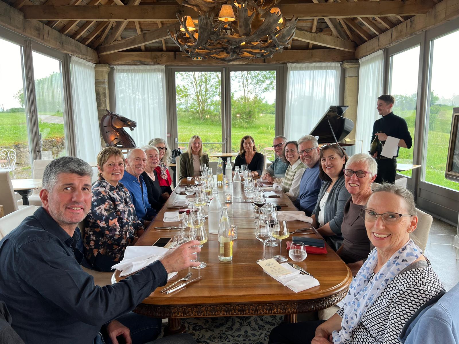 Hikers enjoying wine before dinner on the Le Puy Camino in France