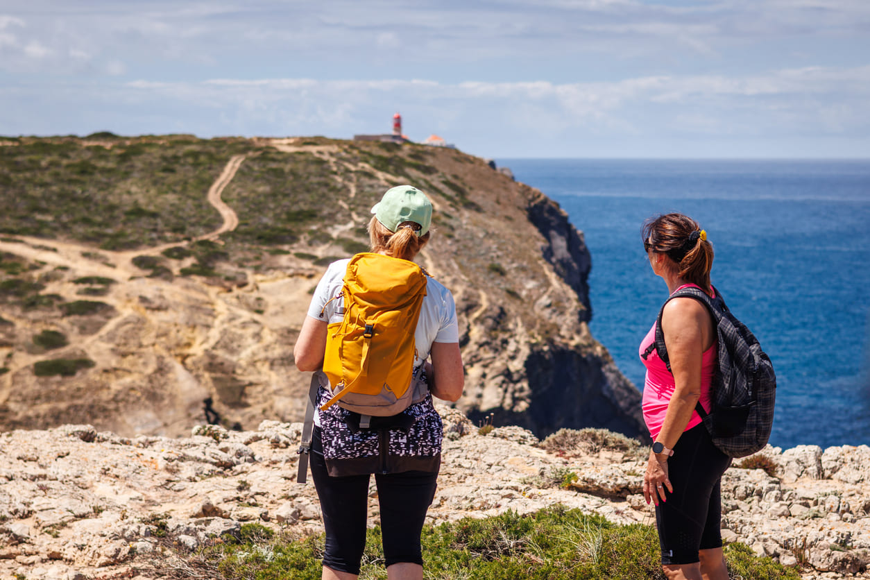 Hikers looking at lighthouse