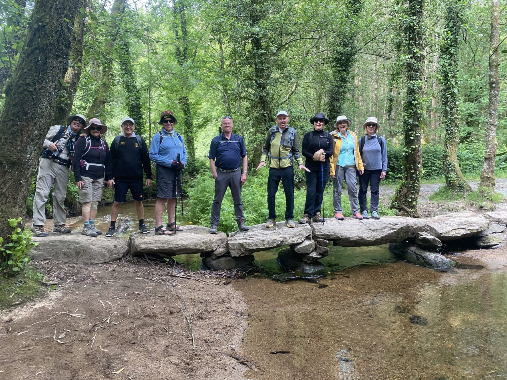 Hikers on a stone bridge