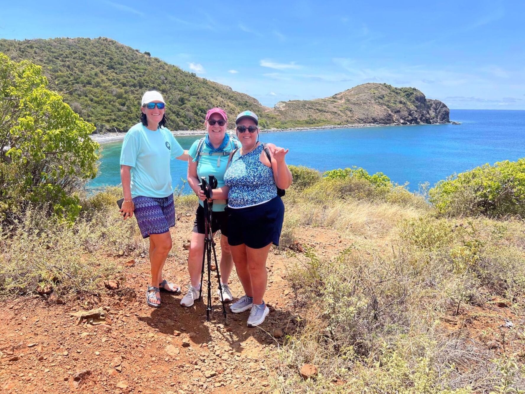 Hikers on a viewpoint overlooking the sea on St. John island in the Caribbean