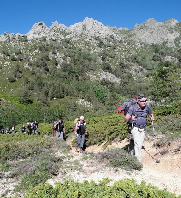 Female hiker above sea, Corsica
