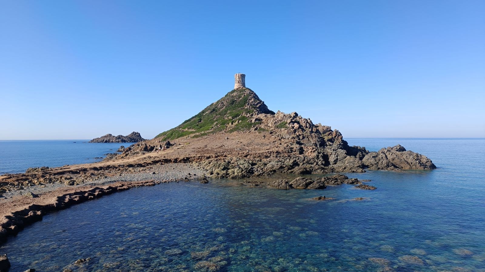 The Genoese tower of Parata seen from a hiking trail on the Corsica train tour