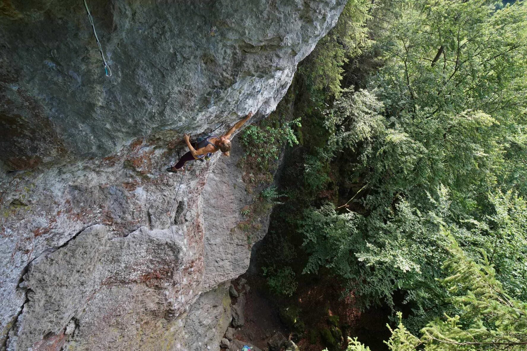 Rock climbing in the woods at Frankenjura on the rock climbing holiday Europe