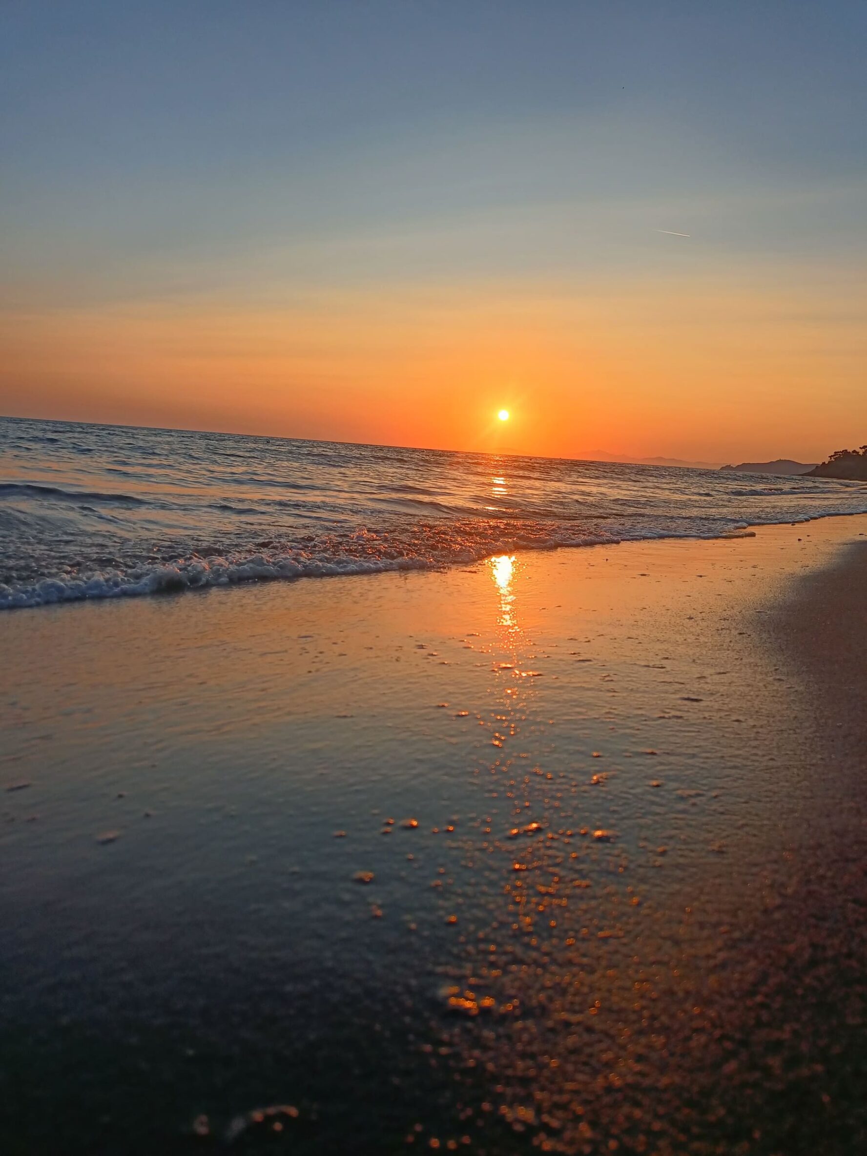 Sandy beach in Tuscany at sunset