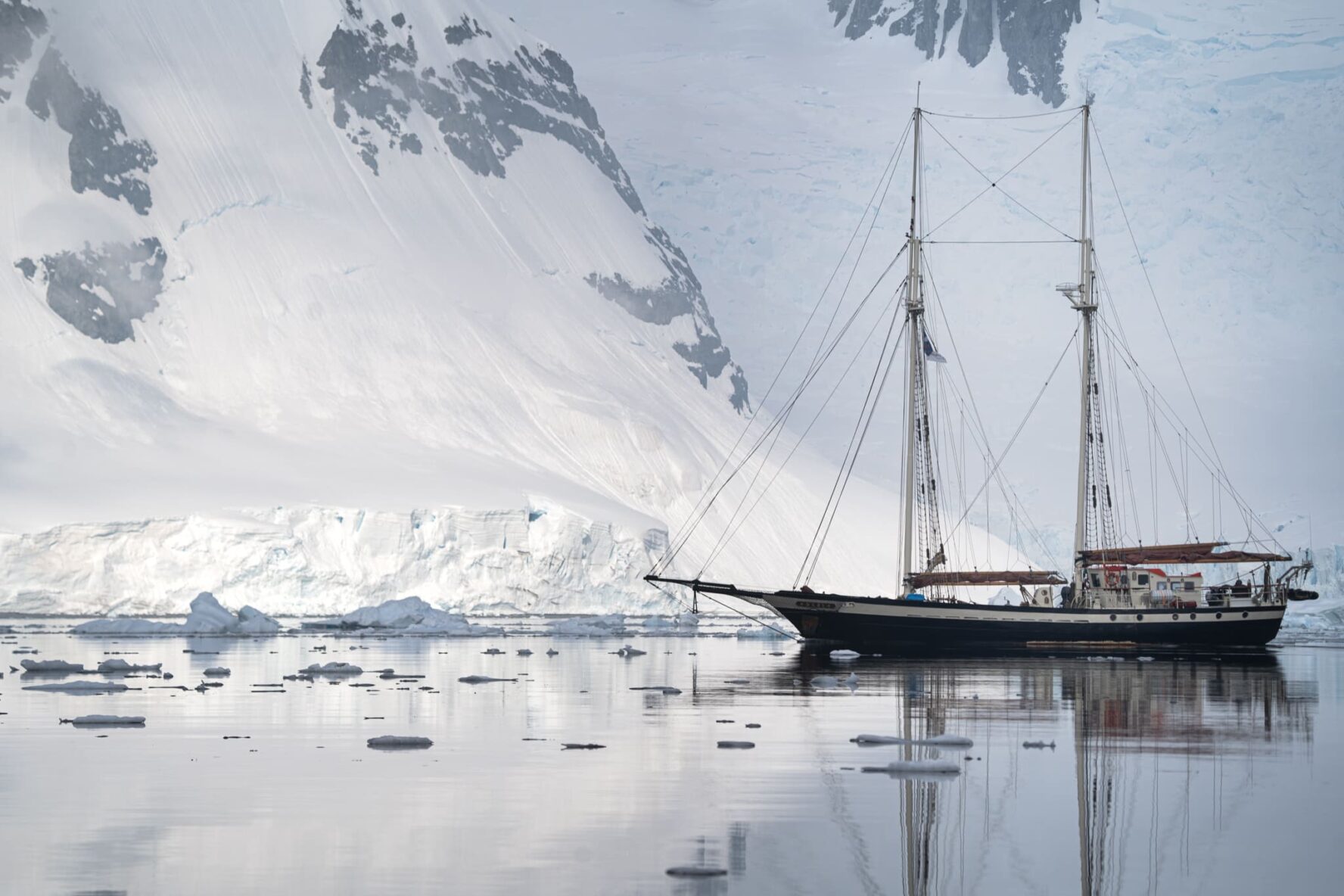 The schooner Elsi anchored in icy waters on the Antarctica adventure