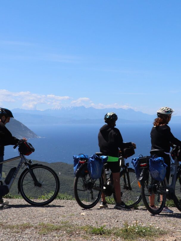 Two riders enjoying panoramic views of Centuri on the North Corsica bike holidays