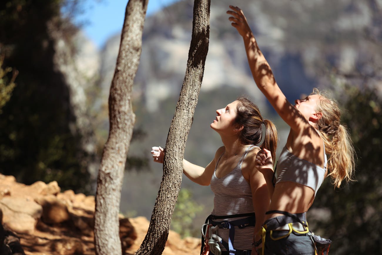 Two climbers looking up at the wall in Gorges du Tarn