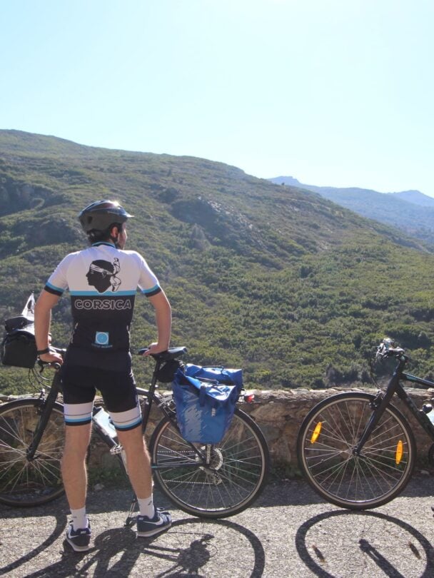 Two riders enjoying panoramic views of Centuri on the North Corsica bike holidays