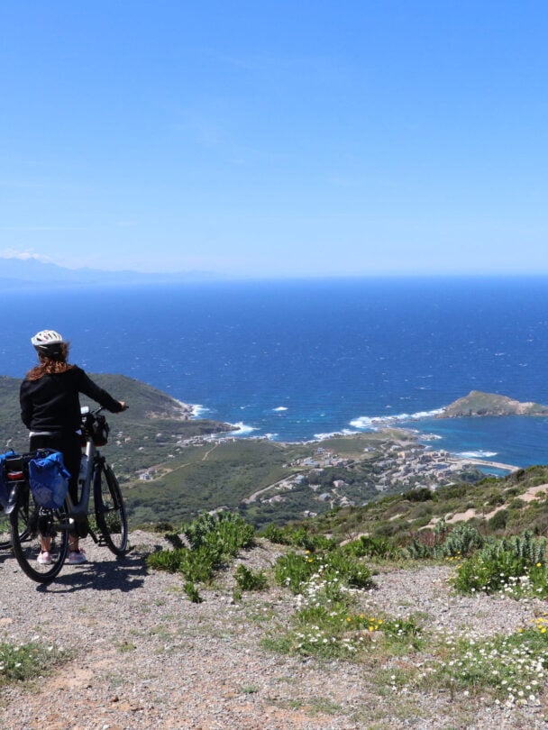 Two riders enjoying panoramic views of Centuri on the North Corsica bike holidays