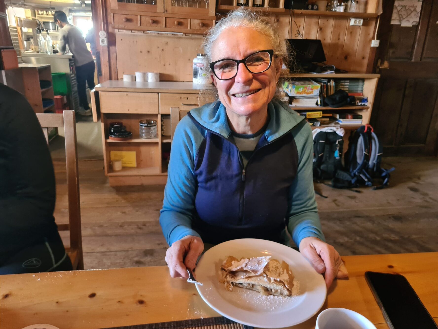 Hiker enjoying Apfelstrudel at Glorerhutte