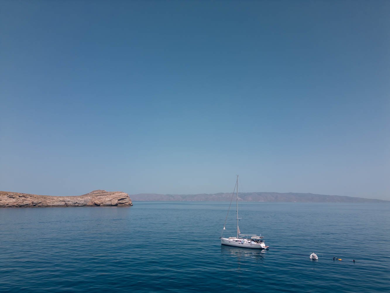 The Bavaria 46 sailboat sailing between islands in Greece