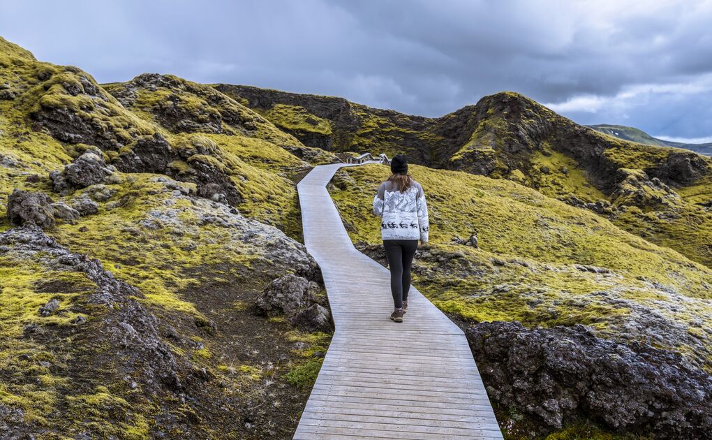 Boardwalk in Iceland, hiker