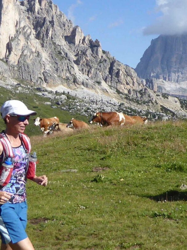 hiker atop dolomites views