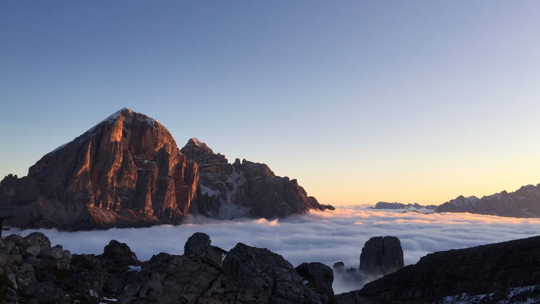 Dolomites above the clouds at sunrise on the Alta Via 1 trail run