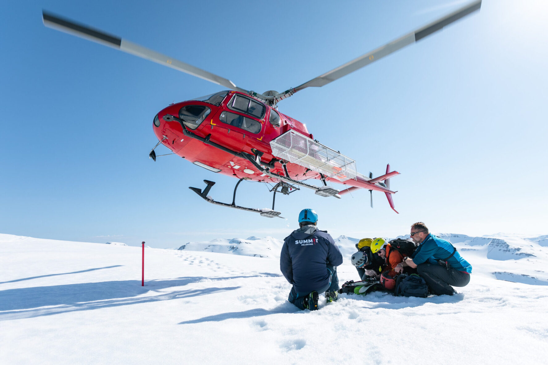 Helicopter taking off from the mountain on the Iceland heli touring adventure