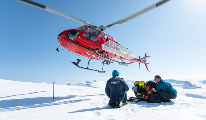 Helicopter taking off from the mountain on the Iceland heli touring adventure