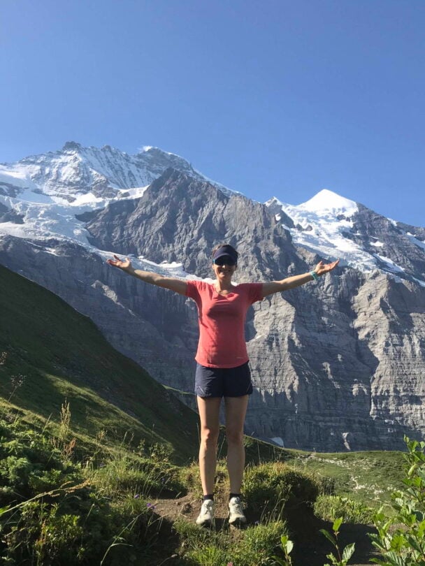 hiker atop dolomites views
