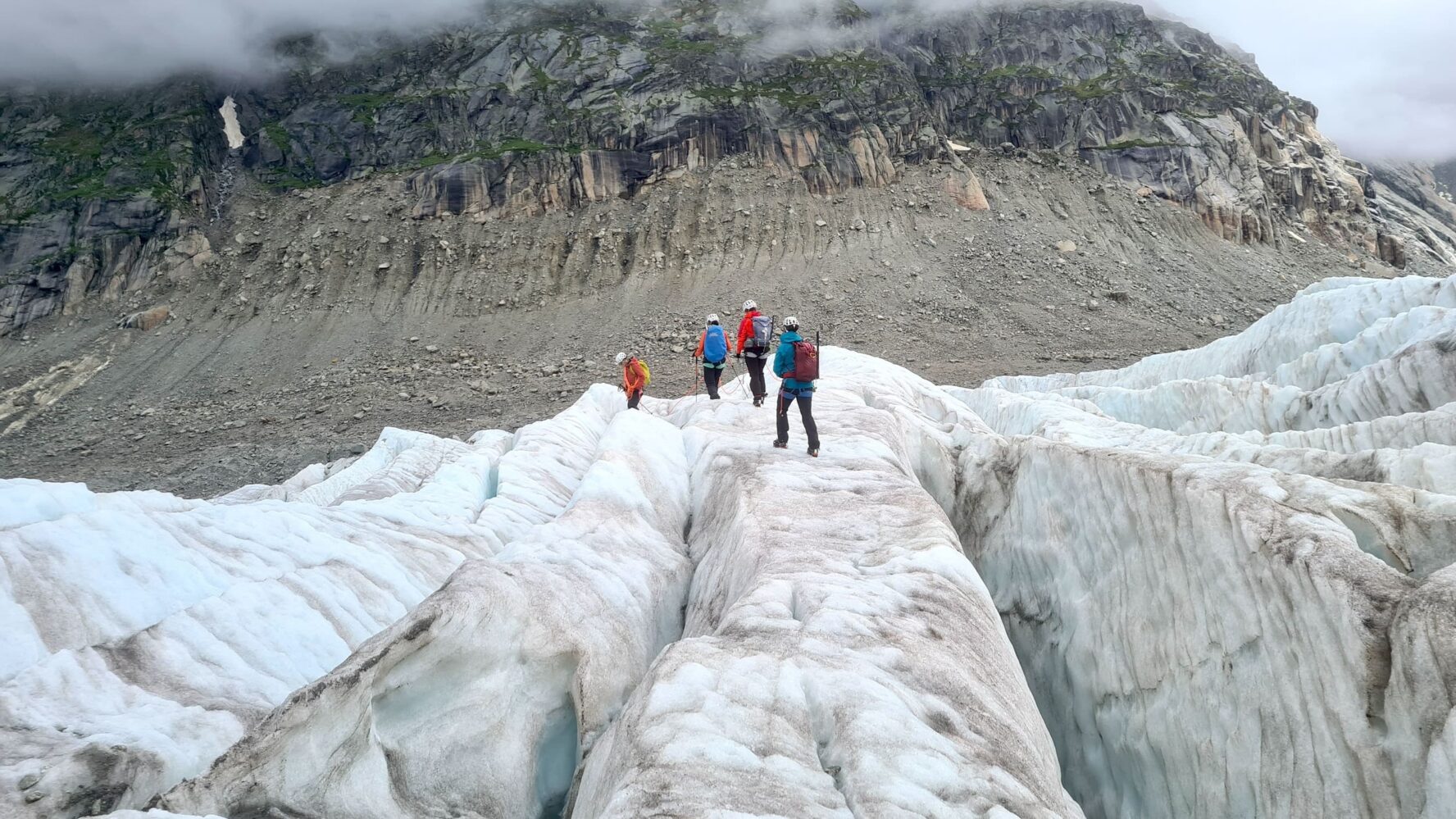 Hikers on a crevasse at Mer de glace
