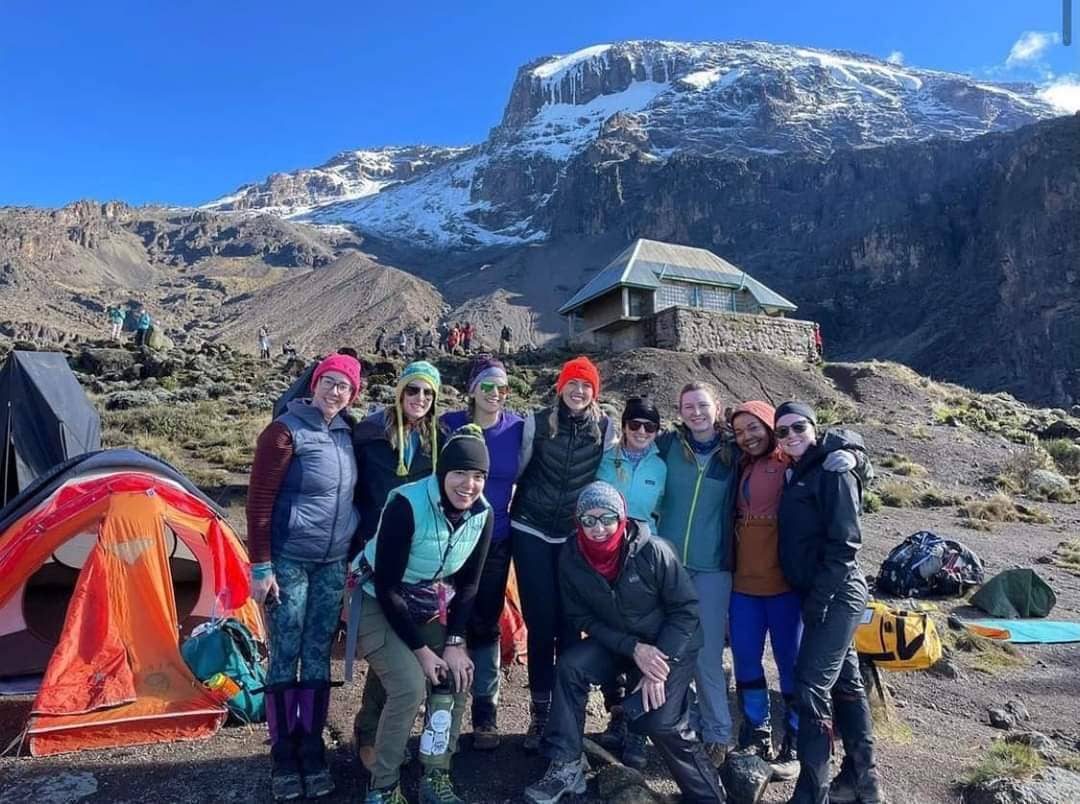 Hikers posing in camp