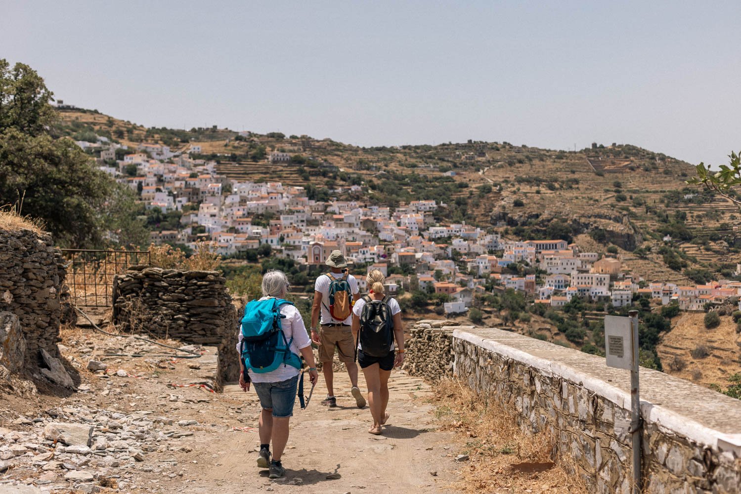 Hikers on a trail towards a village on the Greece freediving holiday