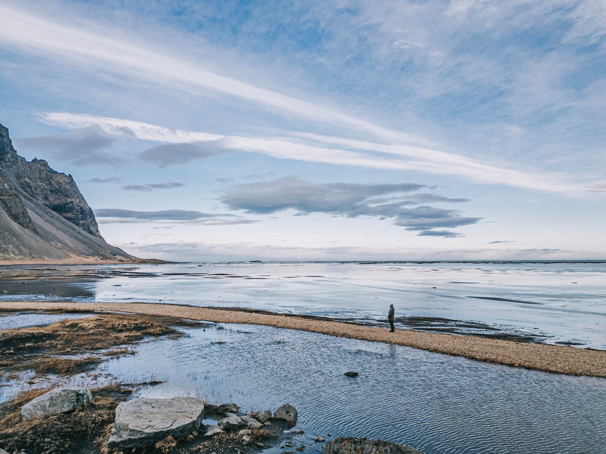 A hiker on the Golden Circle near a beach in Iceland