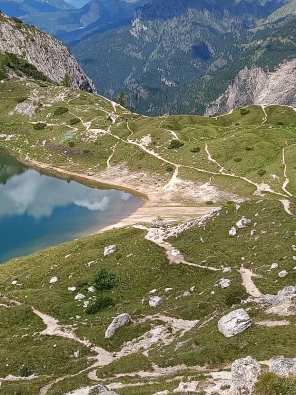hiker atop dolomites views