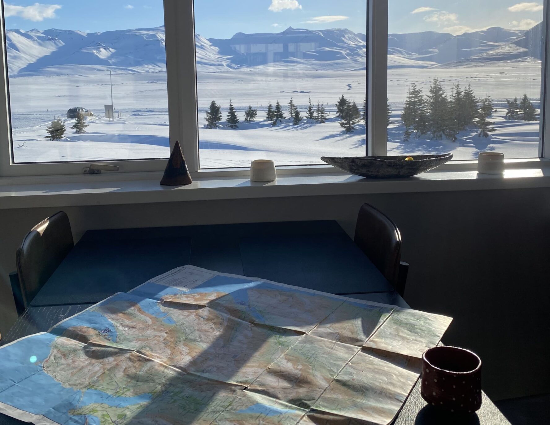 View of a mountainous landscape in North Iceland through the window over coffee