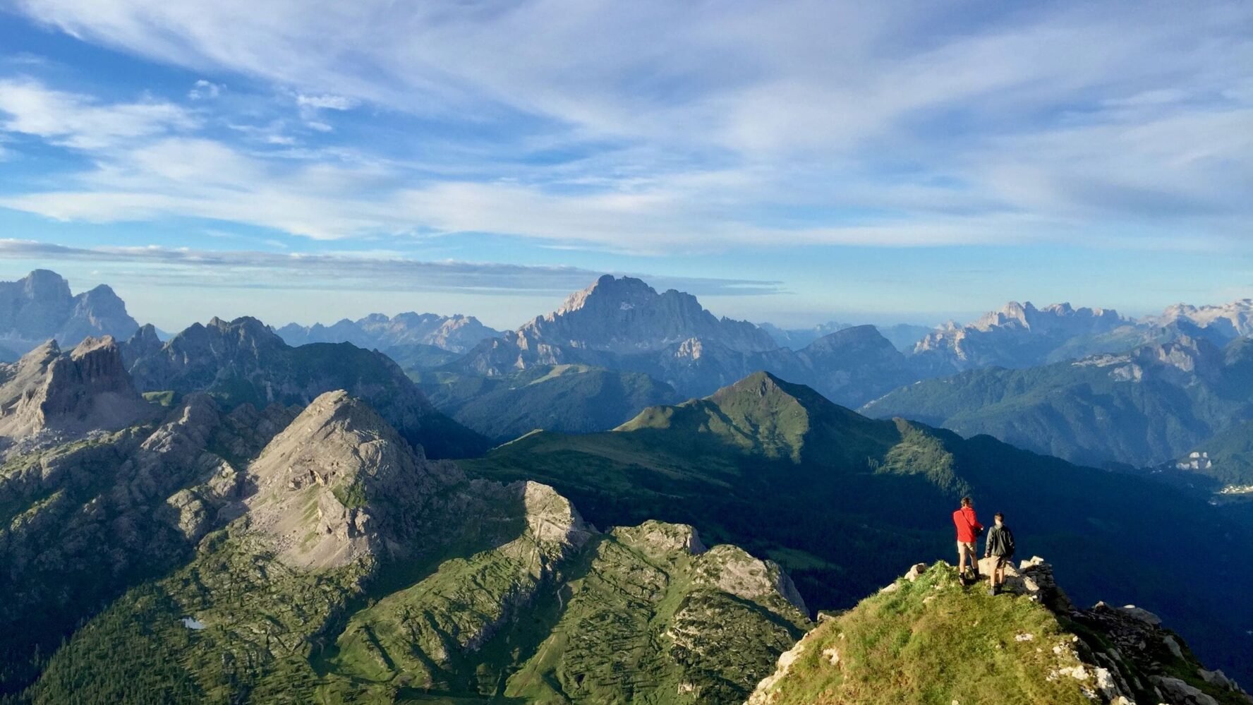 Panoramic view in the Dolomites and hikers
