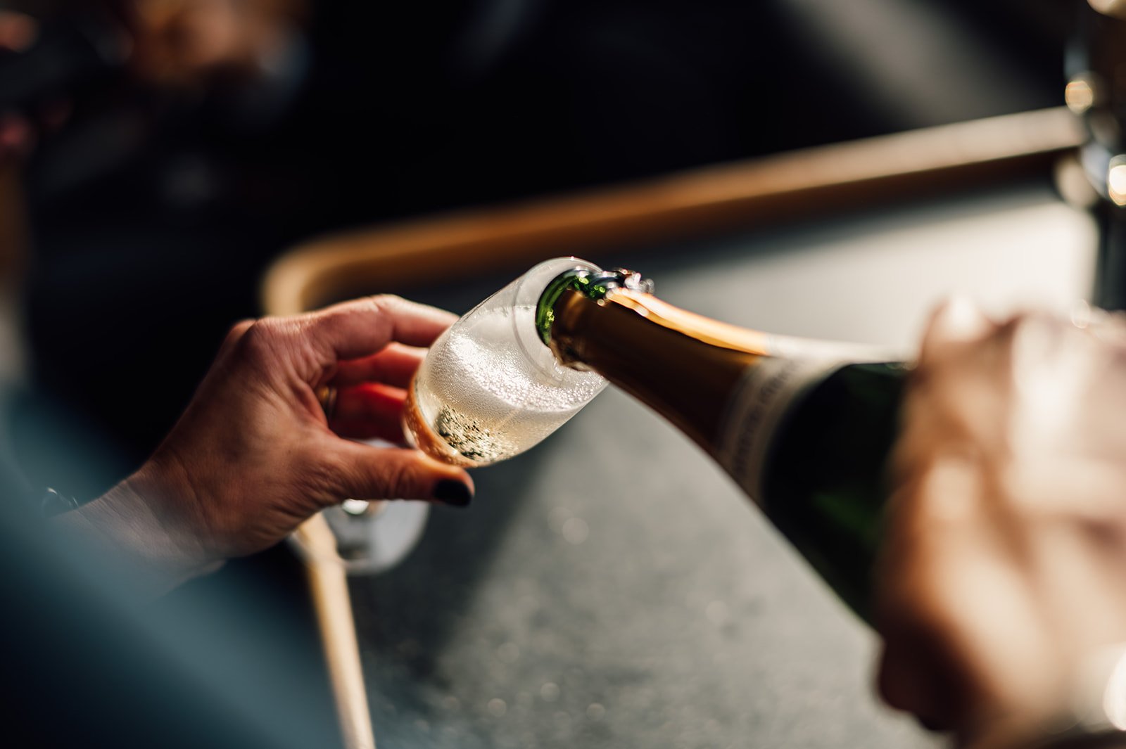 Pouring champagne on the HMS Gassten