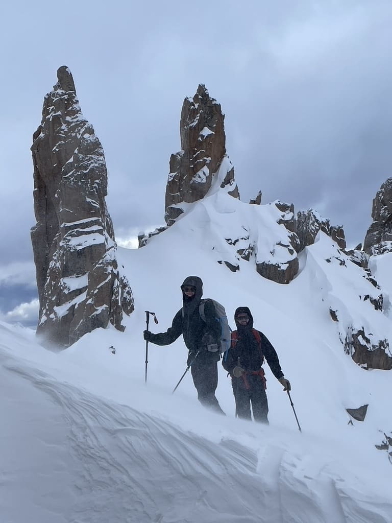 Skiers walking in snow