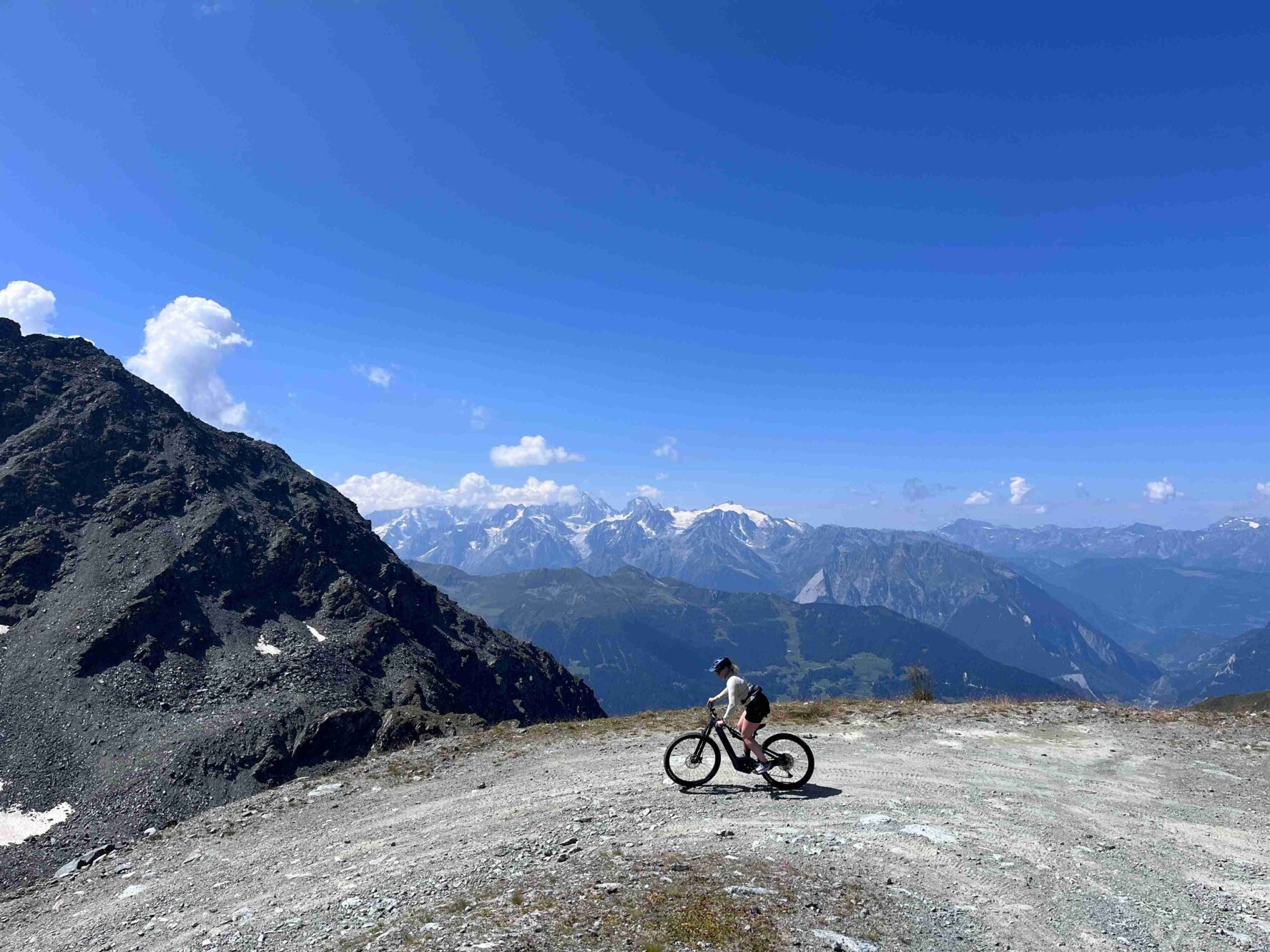 A bike rider taking a turn in the Swiss Valais