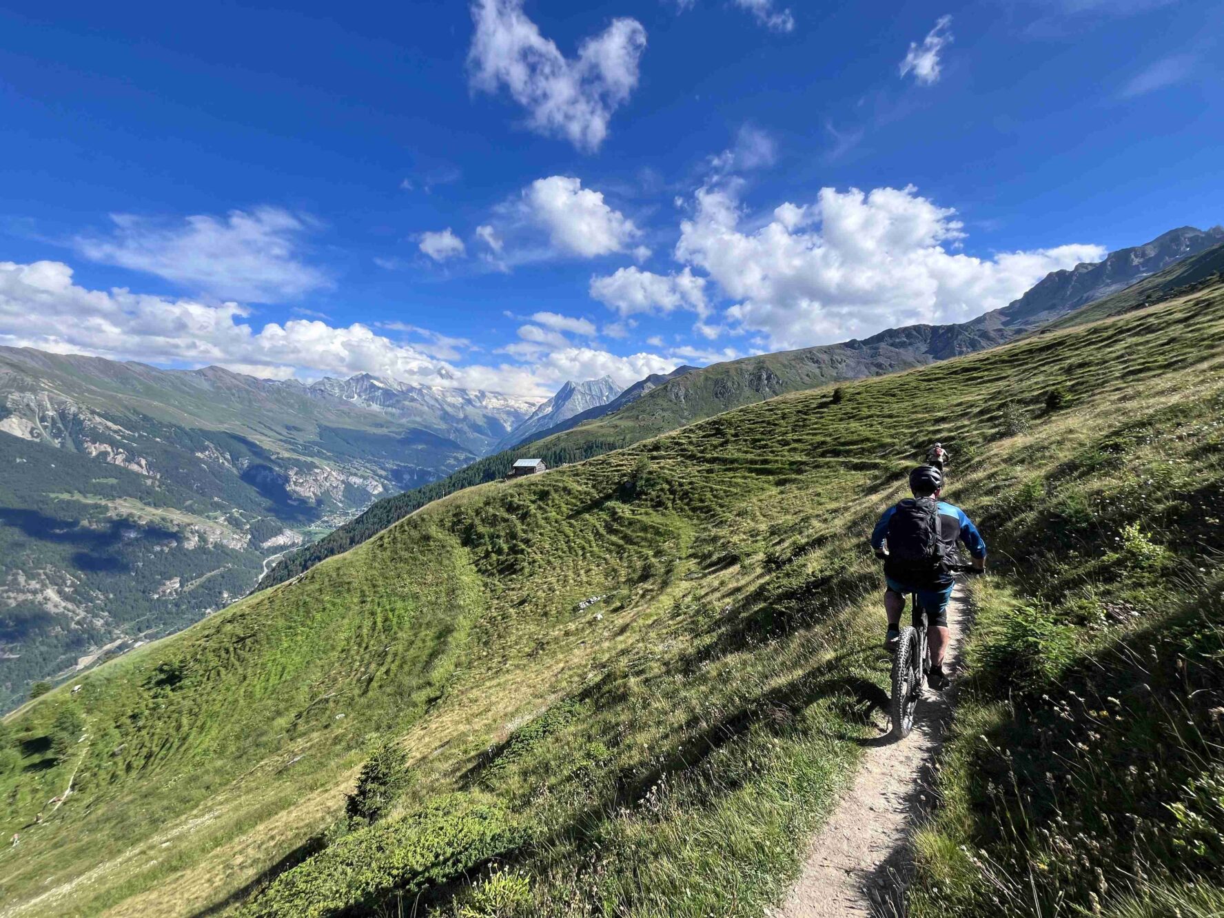 A biker on singletrack in the Swiss Valais