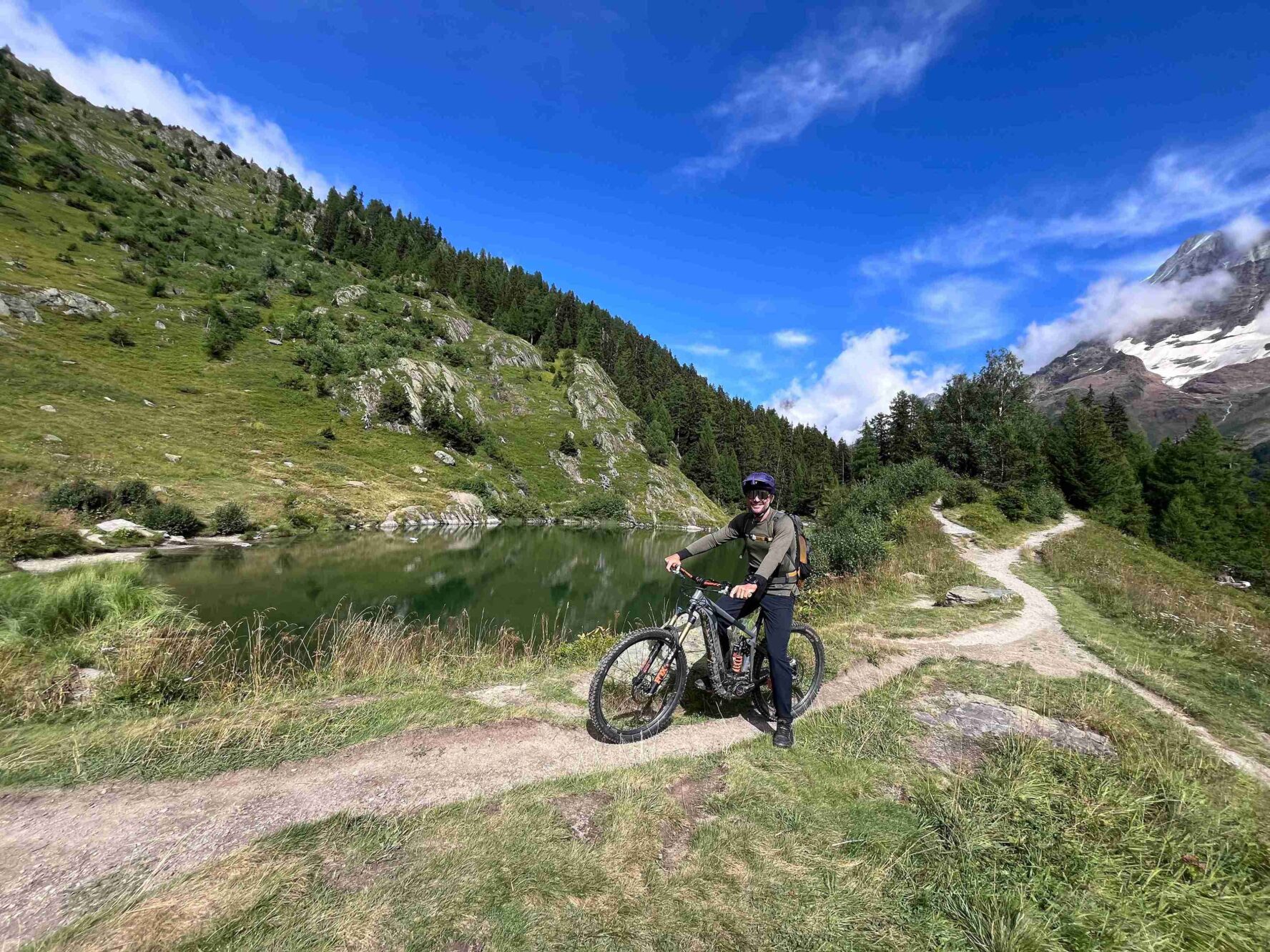 Swiss Valais rider near a lake