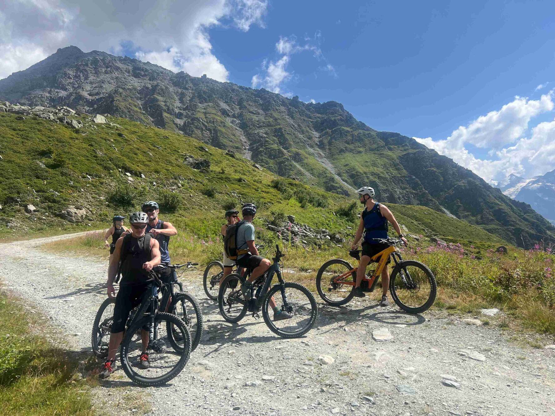 Riders looking back on the Swiss Valais