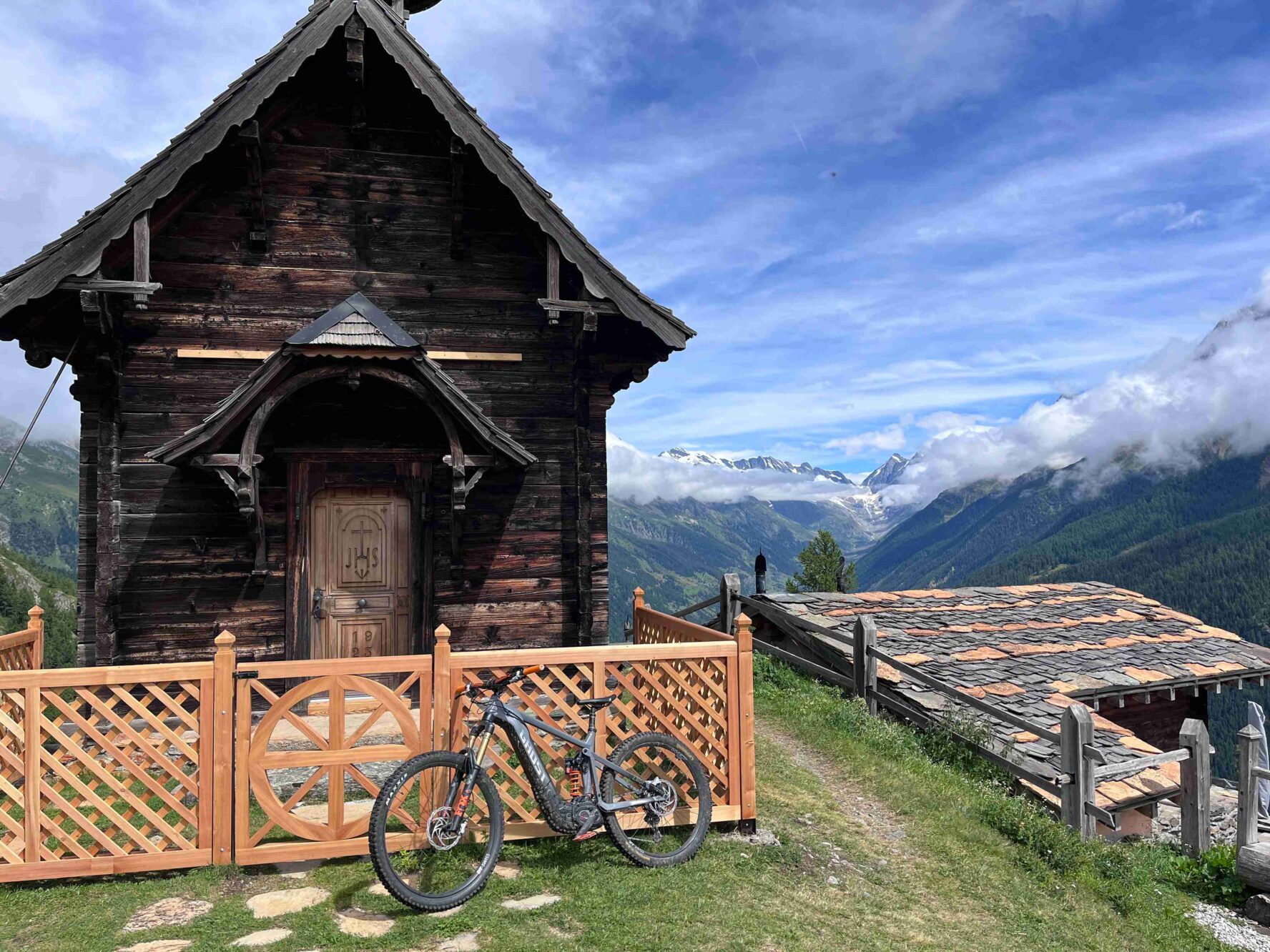 A wooden house and a landscape in the Swiss Valais