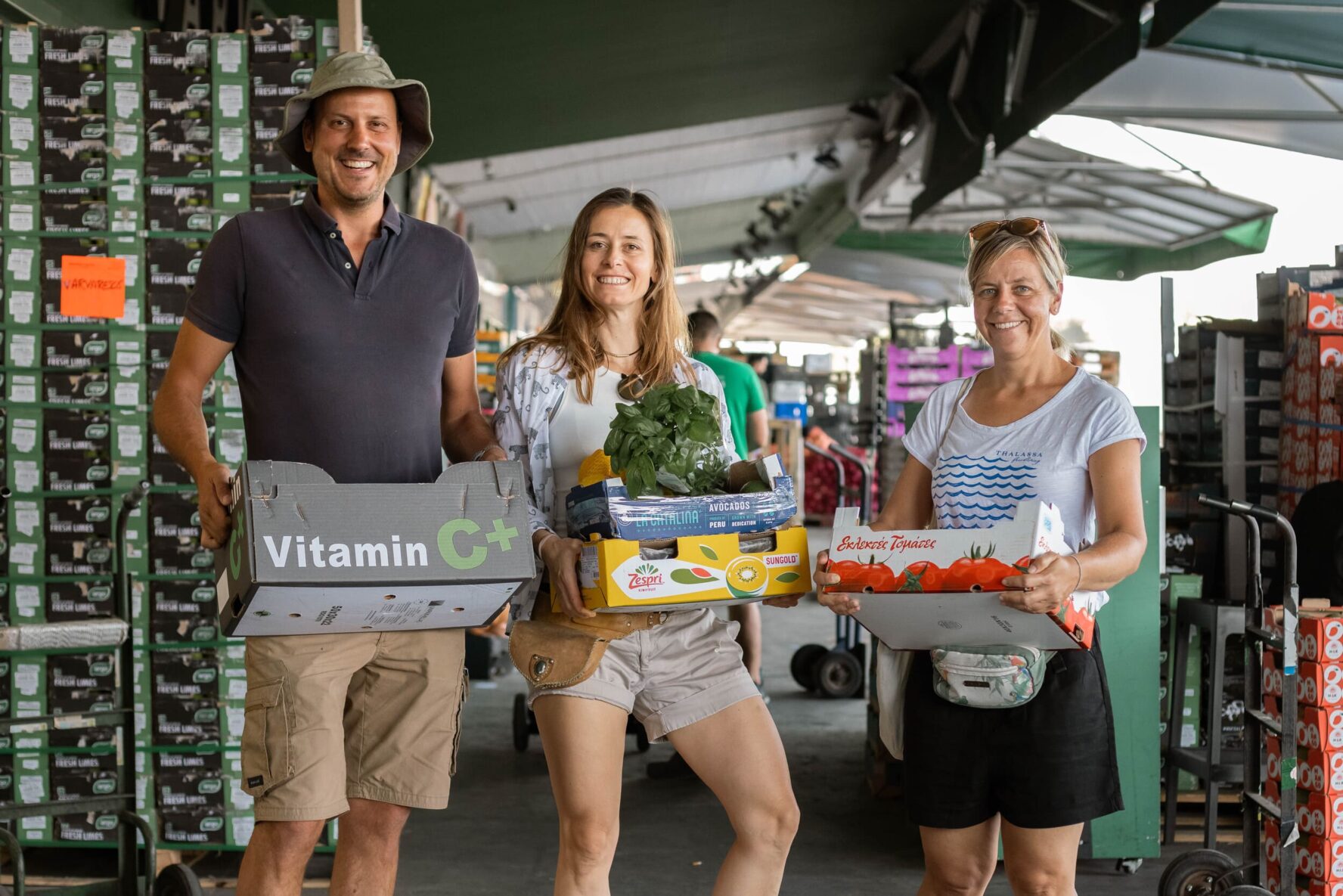 Three people shopping for groceries in Greece