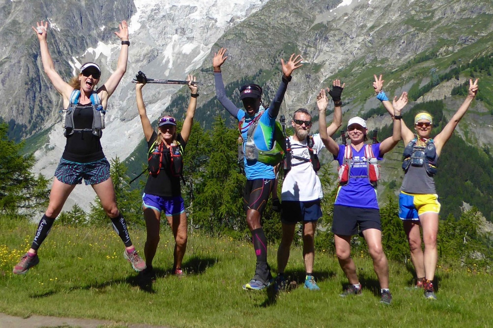 Trail runners celebrating on the Ultra-Trail du Mont Blanc guided tour