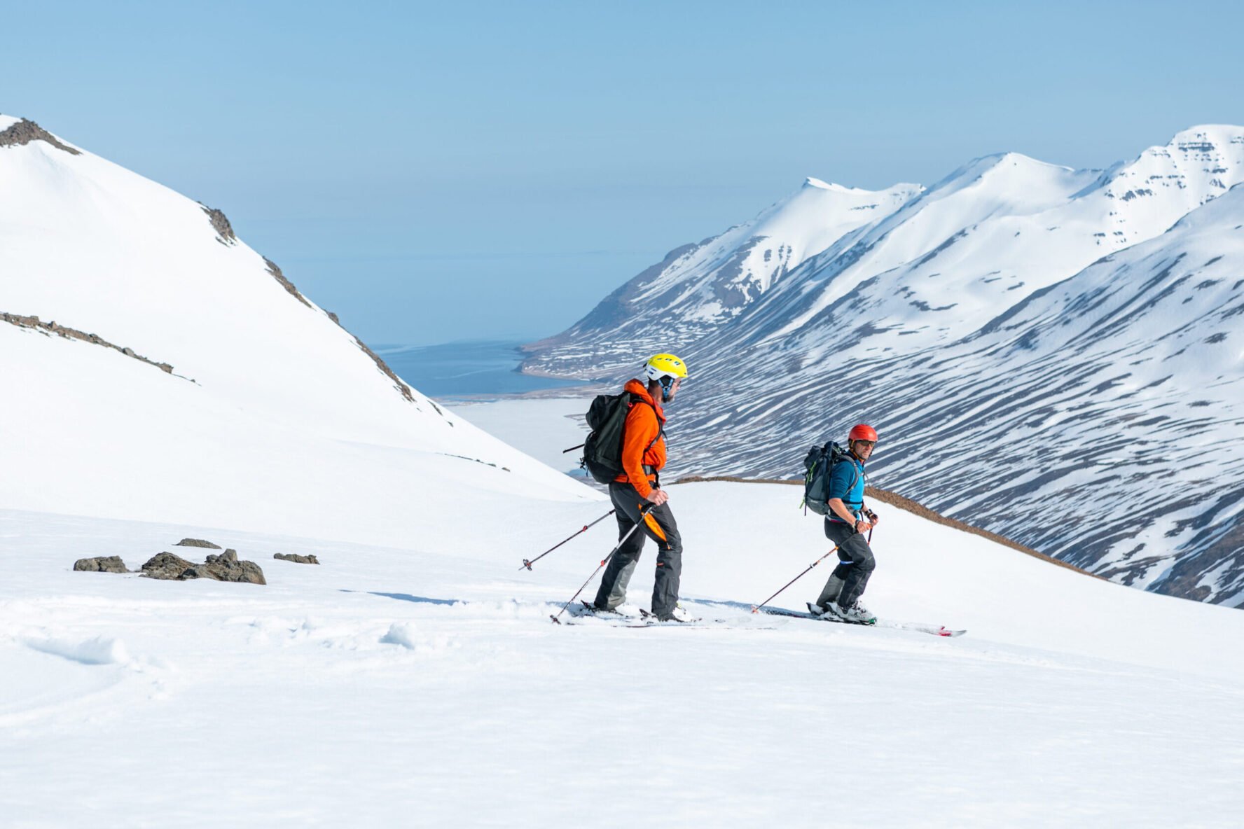 Two skiers on backcountry terrain while Iceland heli touring