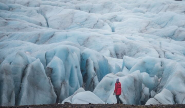 Woman looking at glacier