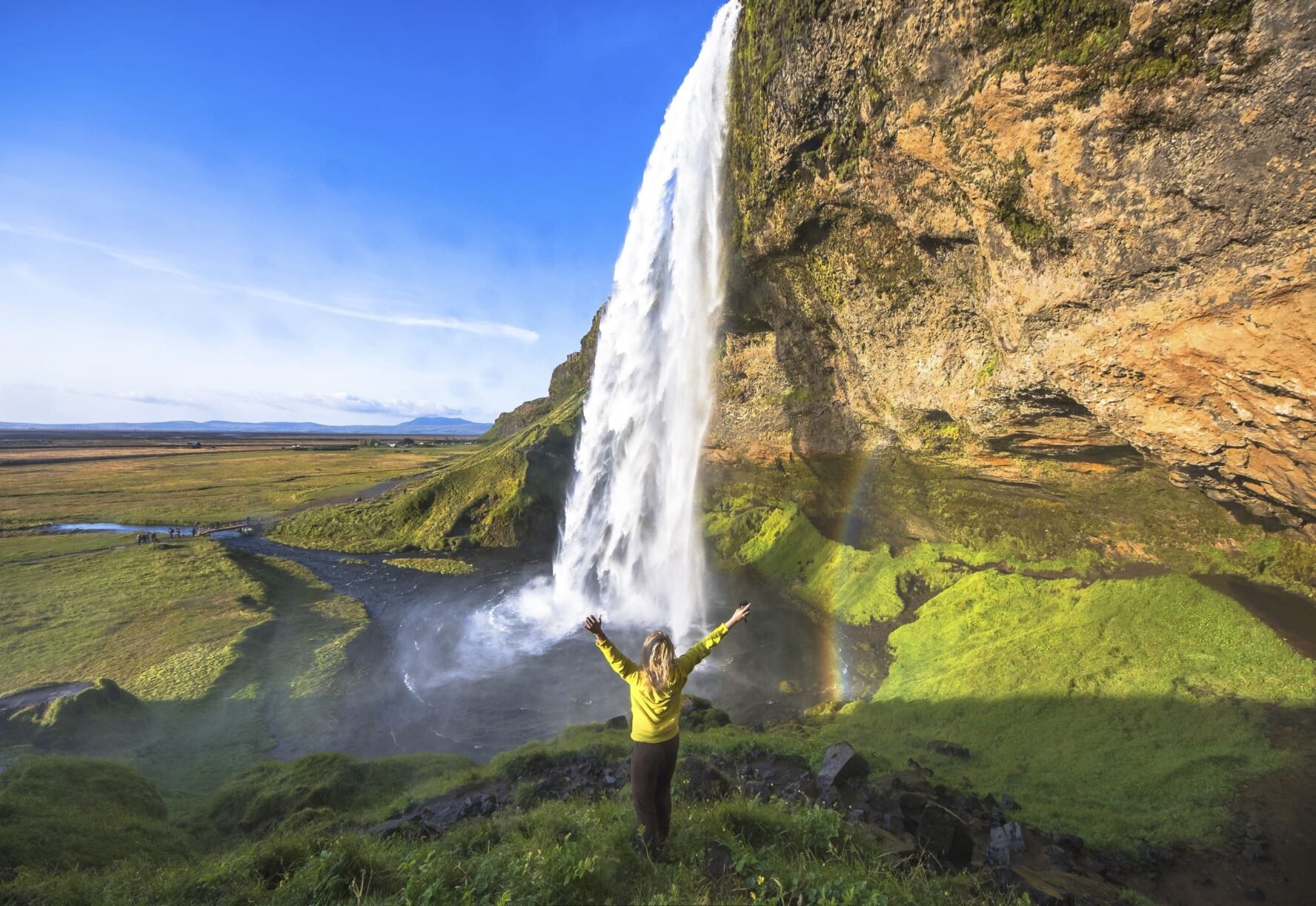 Woman under Seljalandsfoss