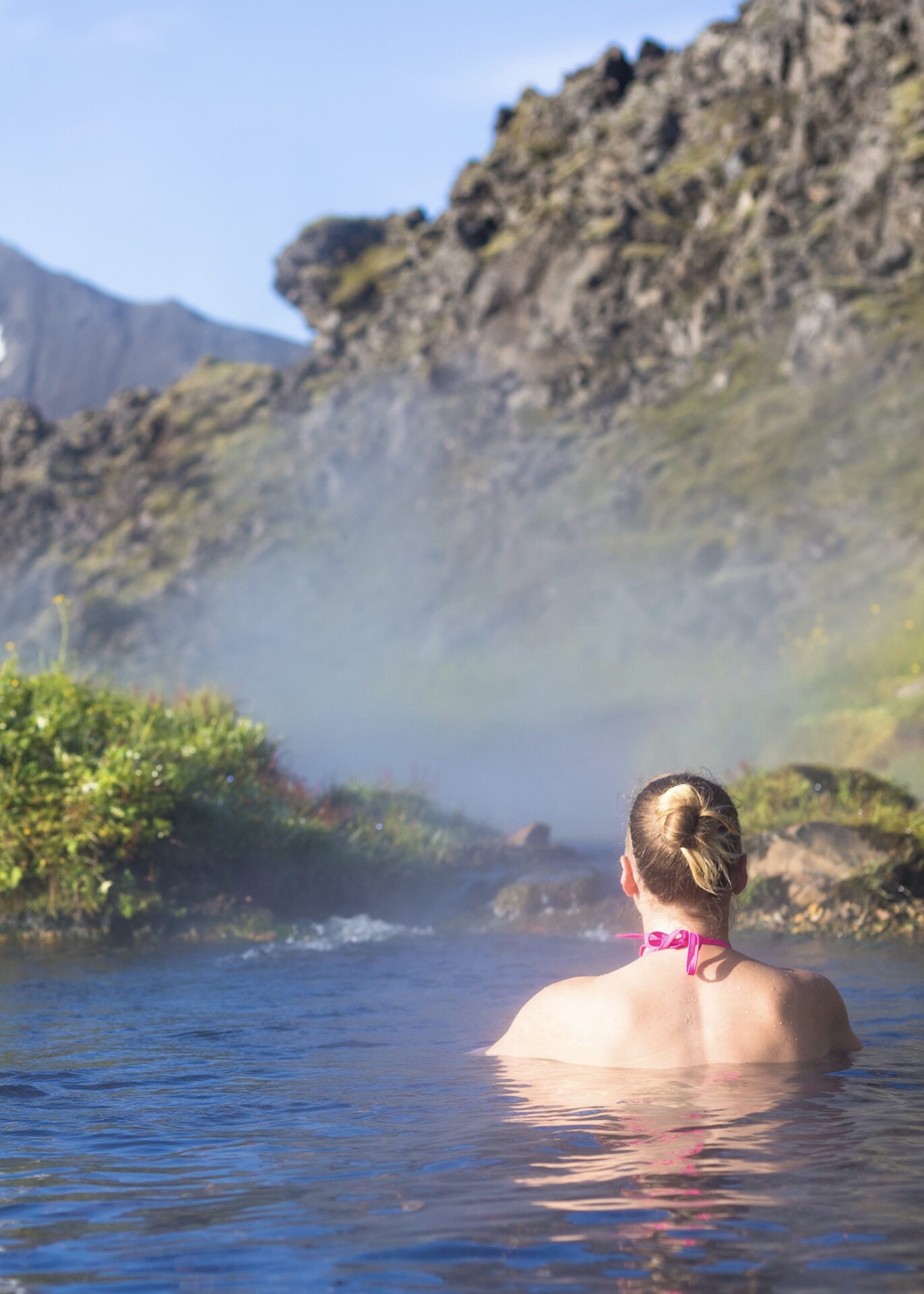 Woman in hot pool in Iceland