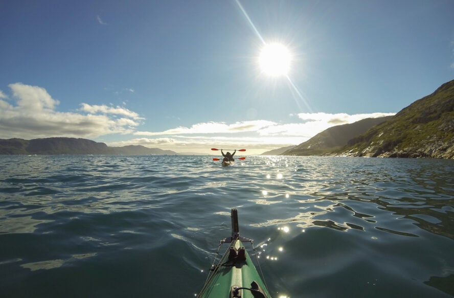A man happy doing Arctic kayaking