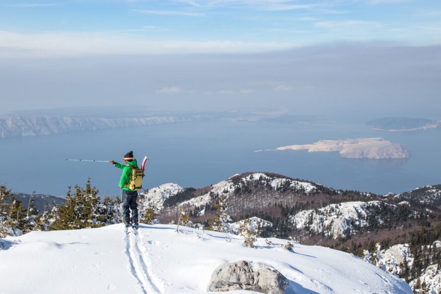 Best time to visit Croatia - a man ski mountaineering in the Adriatic seaside